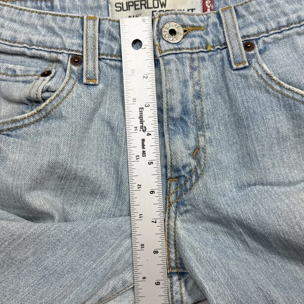 Vintage Levi's 518 Superlow Bootcut Jeans 31x31 Blue Light Wash Low Rise Stained